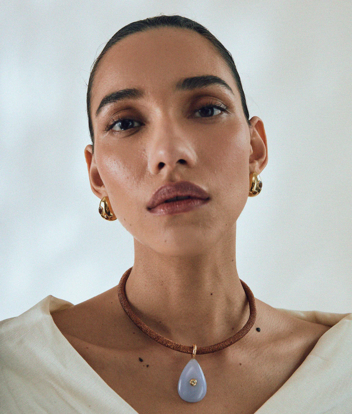 Mini Arp Earrings in Studded Gold